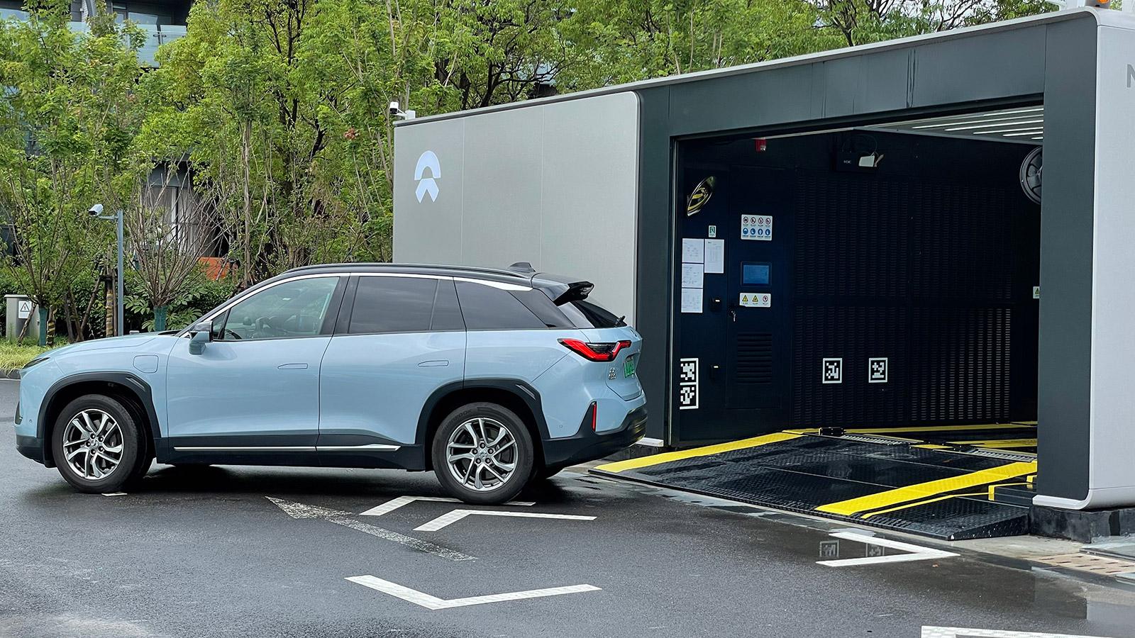 A file photo shows a Nio ES6 preparing to swap its battery at a Nio battery swap station.
